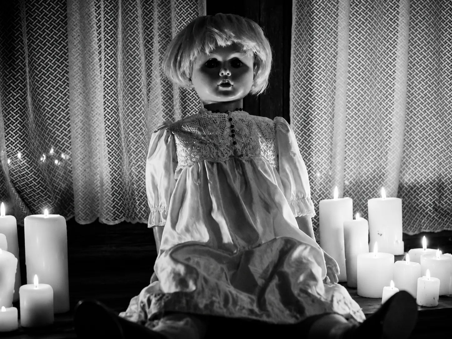 Peggy the Doll Haunted doll in candlelight shadows